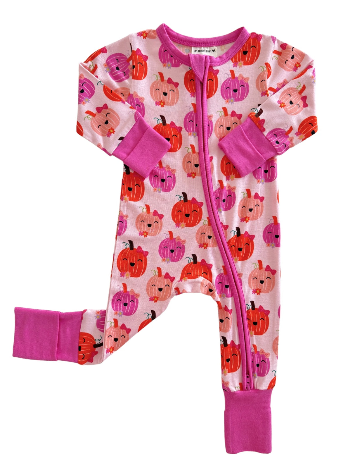 Pink toddler pajama onesie with colorful pumpkin patterns and pink cuffs. Perfect for fall or Halloween.