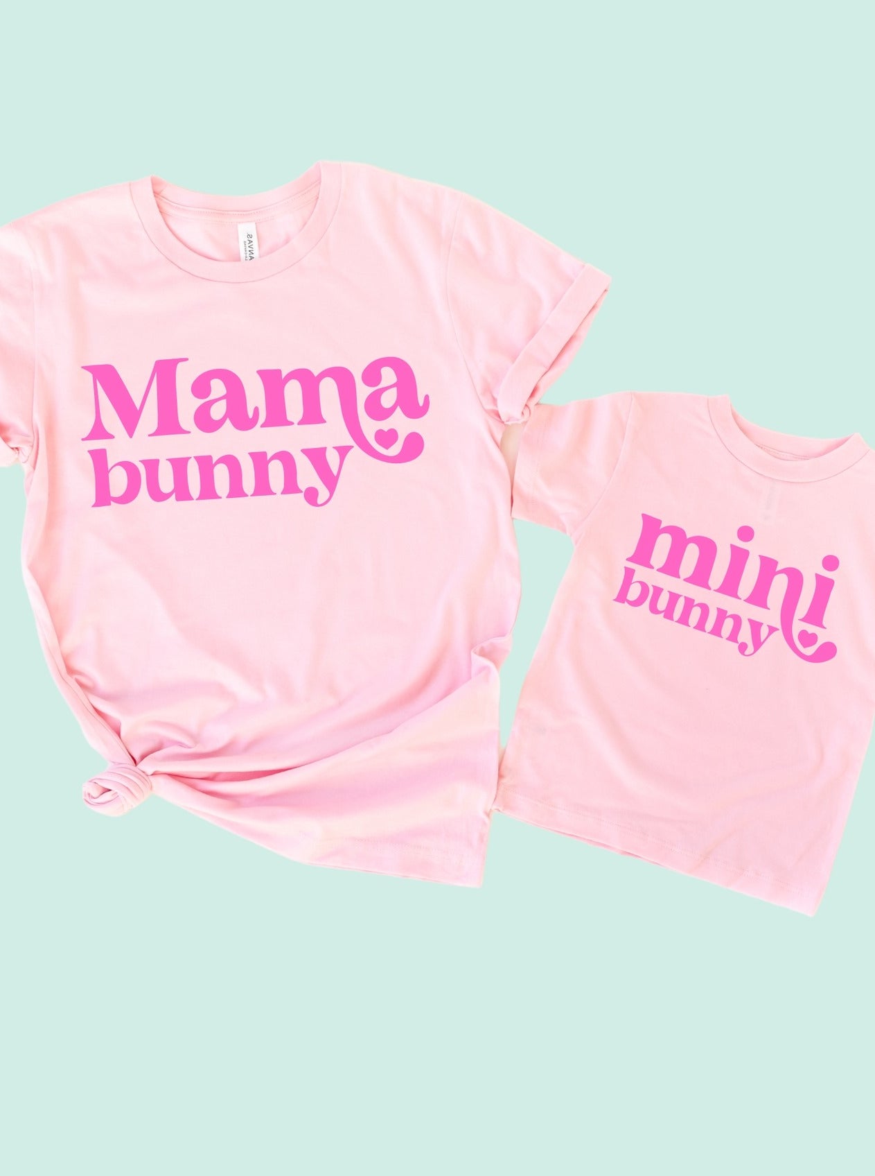 Matching pink "Mama bunny" and "mini bunny" t-shirts for moms and kids. Fun and stylish for family outfits.
