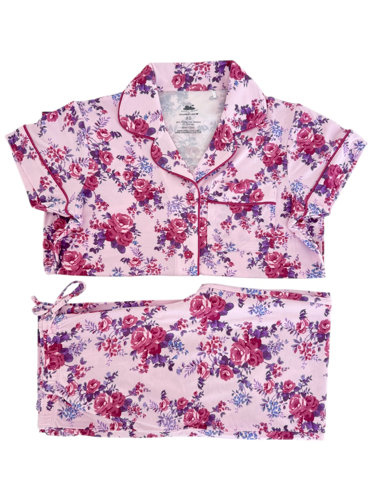 Floral pajama set featuring a short-sleeve top and matching pants in pink, purple, and white colors.