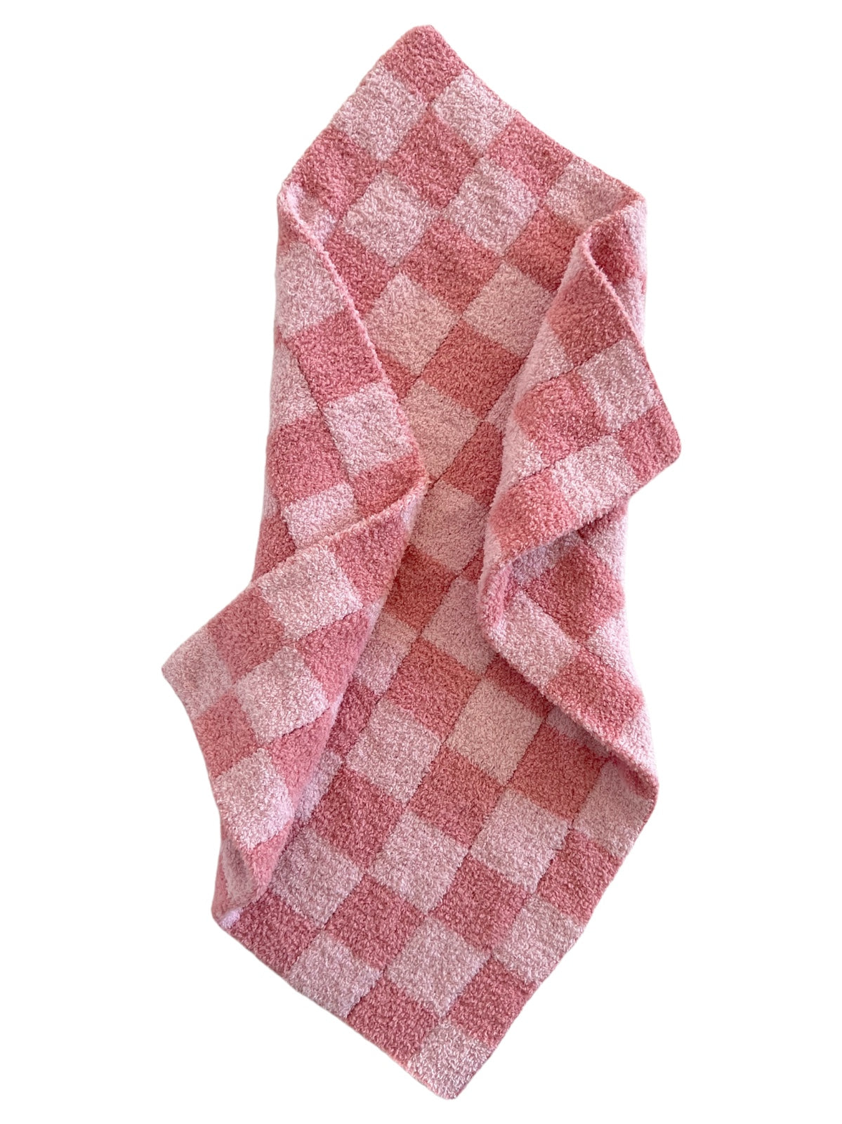 Pink checkered towel draped, featuring a soft texture and alternating light and dark pink squares.