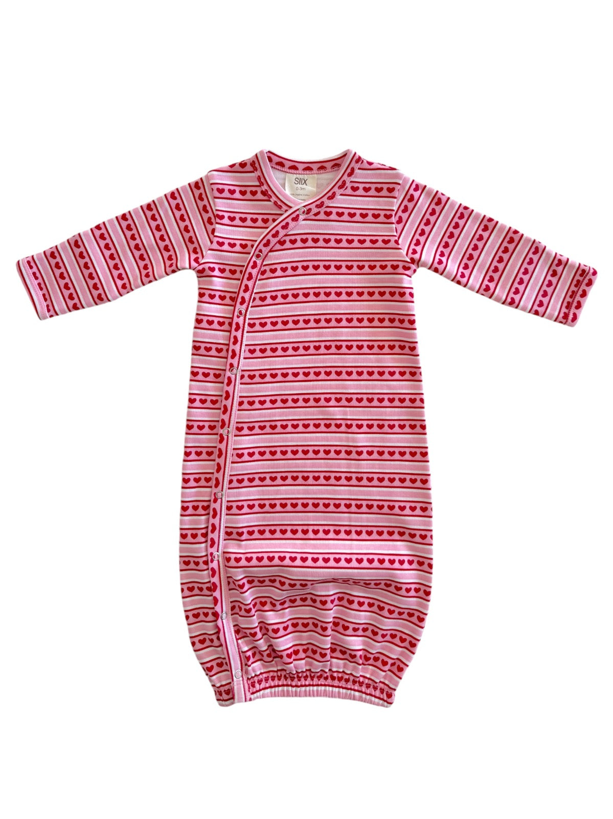Pink striped baby sleep sack with heart patterns and long sleeves. Ideal for comfort and warmth.