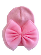 Pink beanie hat adorned with a large, soft, pink bow on the front.