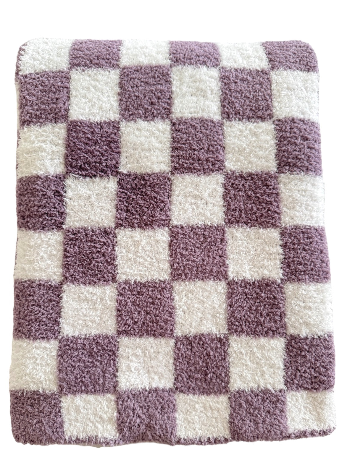 Purple and white checkered rug with a soft, fluffy texture. Ideal for home decor or comfort.