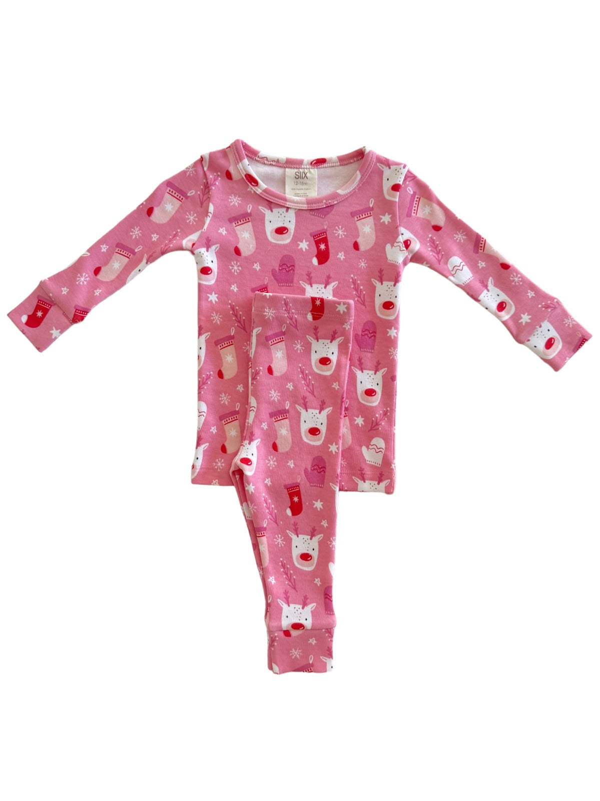 Pink pajama set with reindeer and holiday stockings pattern, featuring long sleeves and matching pants.