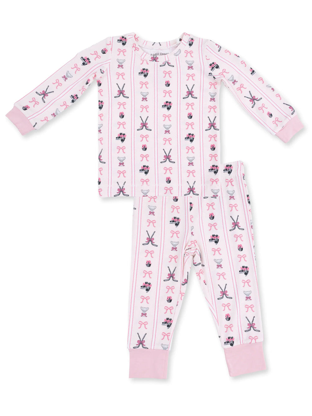 Girls' pink pajama set with patterns of bows, teacups, and ballet slippers on soft fabric.