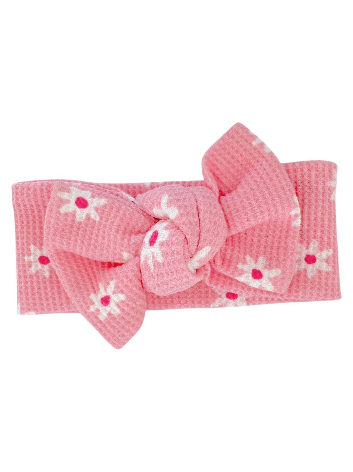 Pink headband with a large bow, featuring white flowers with pink centers.