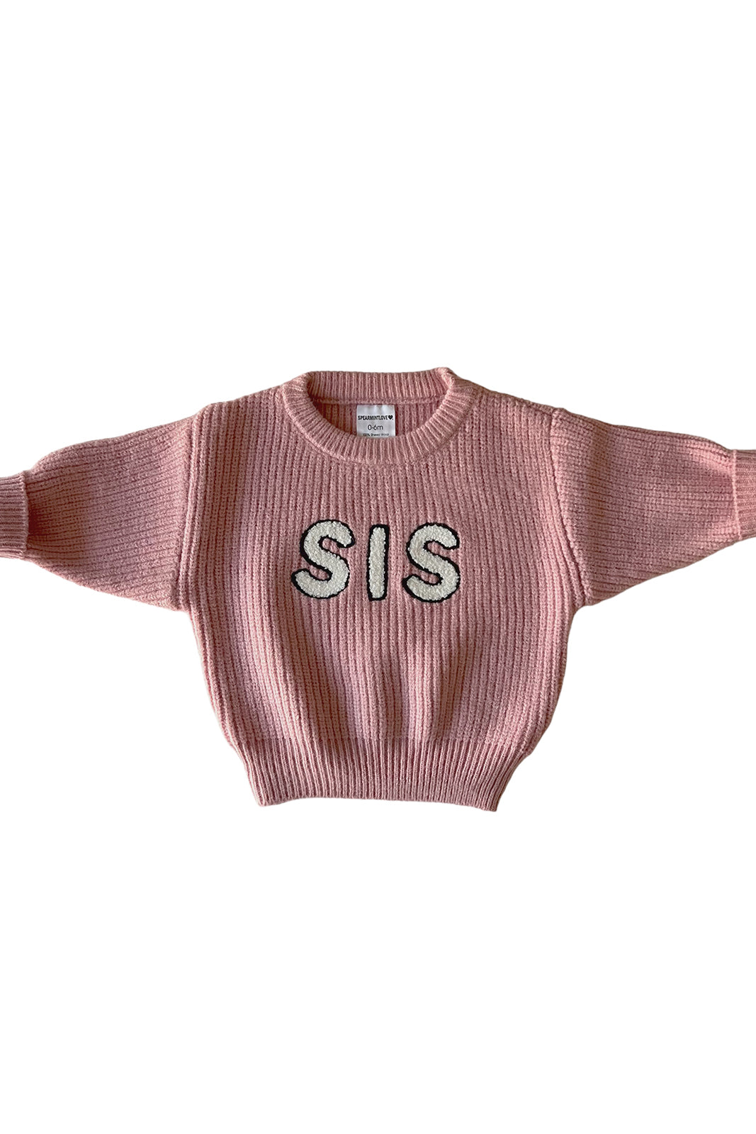 Pink knit sweater with "SIS" embroidered on the front in sparkly letters.