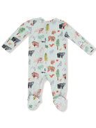 Baby onesie with colorful animal and tree prints on a light green background. Features footed design with polka dots.