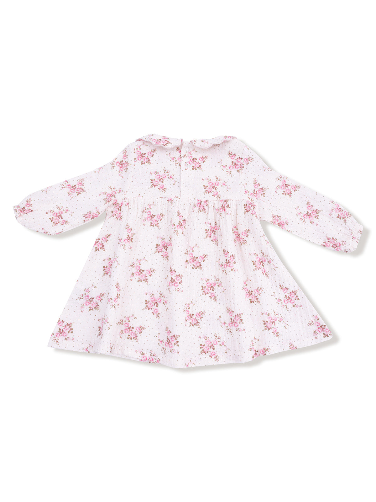 White floral dress with long sleeves and a gathered waist, featuring pink blossoms and a round collar.