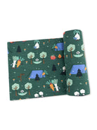 Colorful fabric design featuring camping vegetables and trees on a green background. Perfect for playful projects.