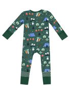 Green patterned pajama onesie featuring camping, trees, and vegetable graphics, with polka dot cuffs and feet.