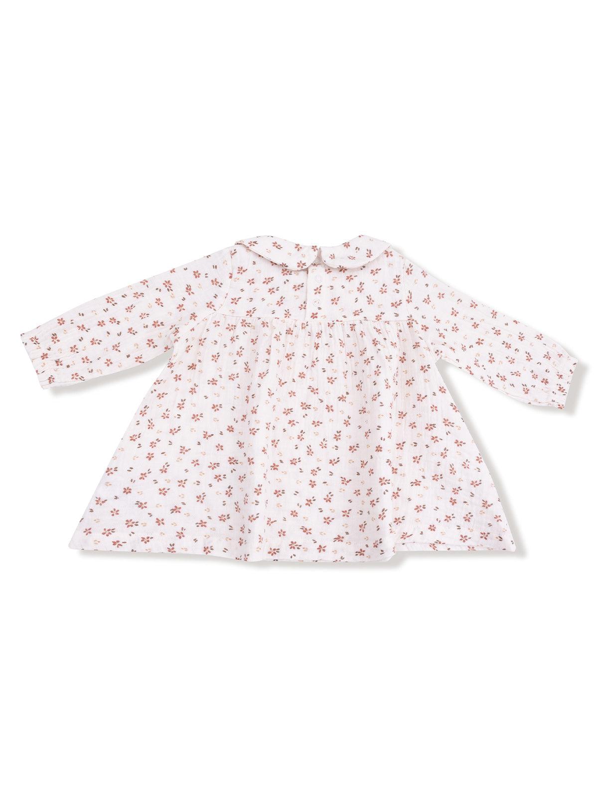 White toddler dress with long sleeves and floral print, featuring a collar and back button closure.