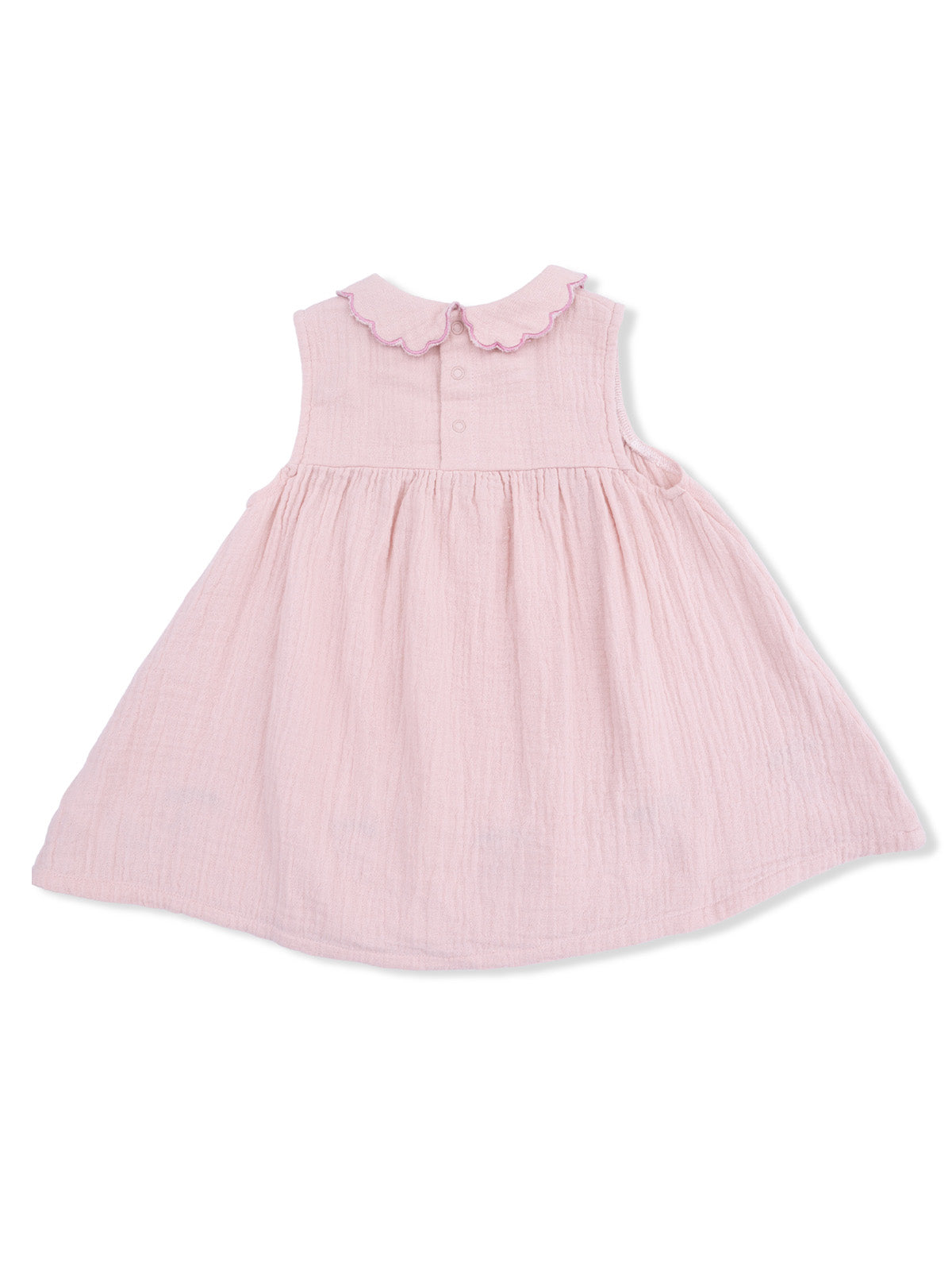 Light pink sleeveless dress with a scalloped collar and button details on the back. Perfect for young girls.