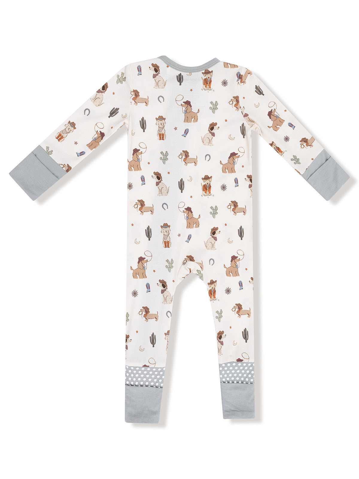 Children's pajama onesie featuring playful dog and cactus patterns in light colors with gray accents.