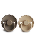 Two silicone pacifiers in taupe and beige, featuring a scalloped design for a modern look.