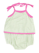 Green and white checkered baby swimsuit with pink trim and adjustable shoulder ties.