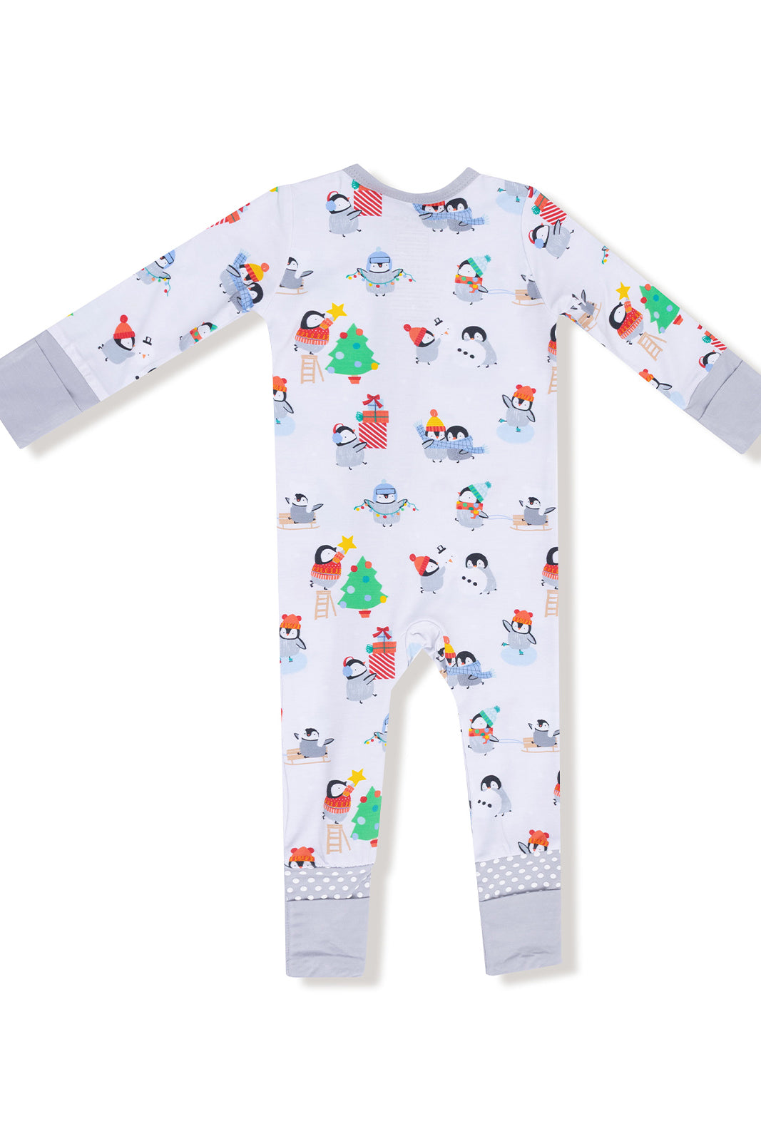 Winter-themed toddler pajamas featuring playful penguins, Christmas trees, and festive decorations.