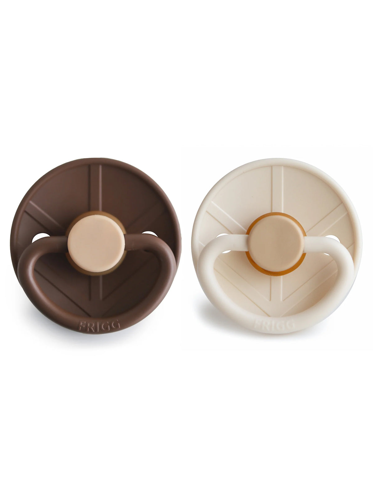 Two silicone pacifiers in brown and cream colors, featuring round shapes and comfortable grips for babies.
