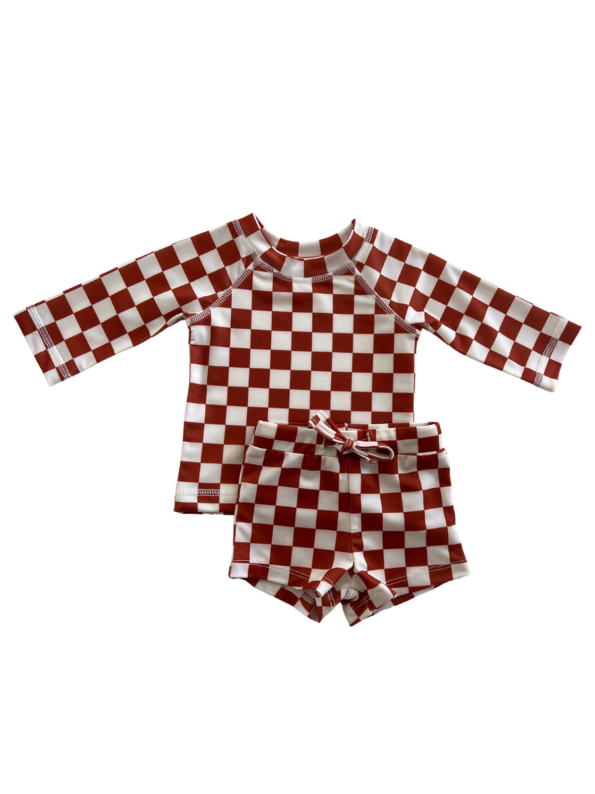 Red and white checkered children's swim shirt and shorts set laid flat.