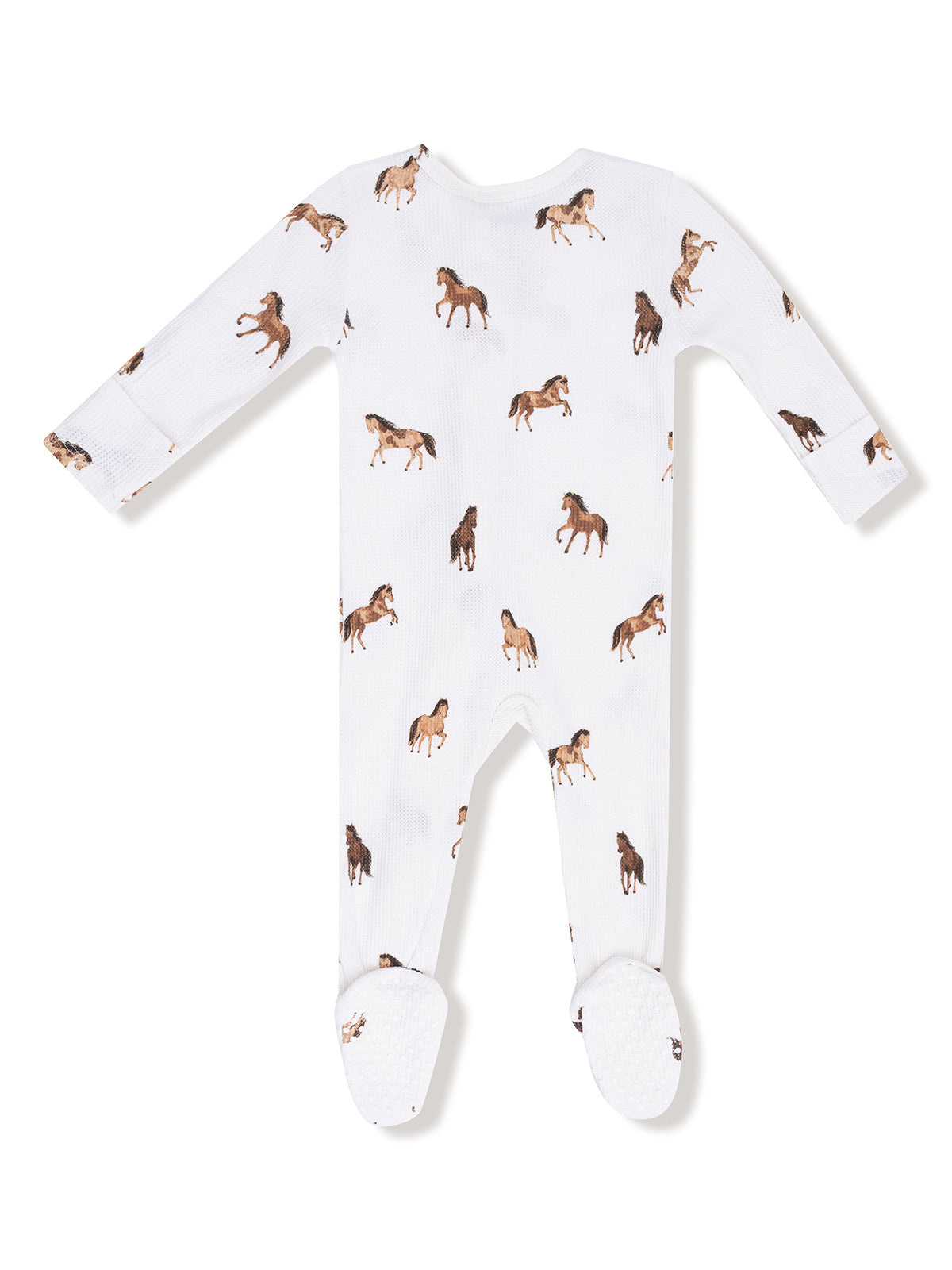 White baby onesie with horse prints and footed design, featuring long sleeves and a soft texture.