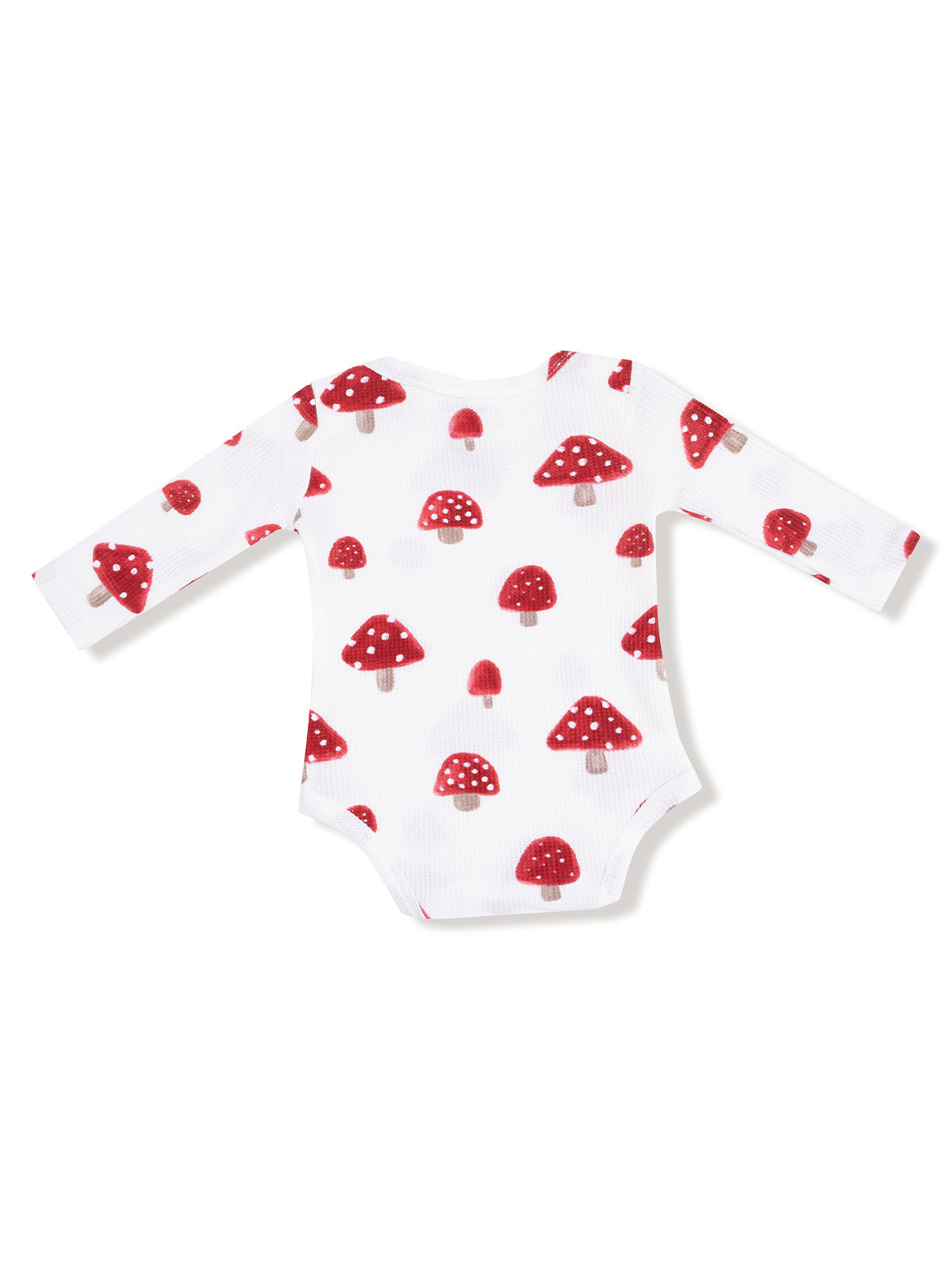Long-sleeve baby onesie with red mushroom pattern on a white background.