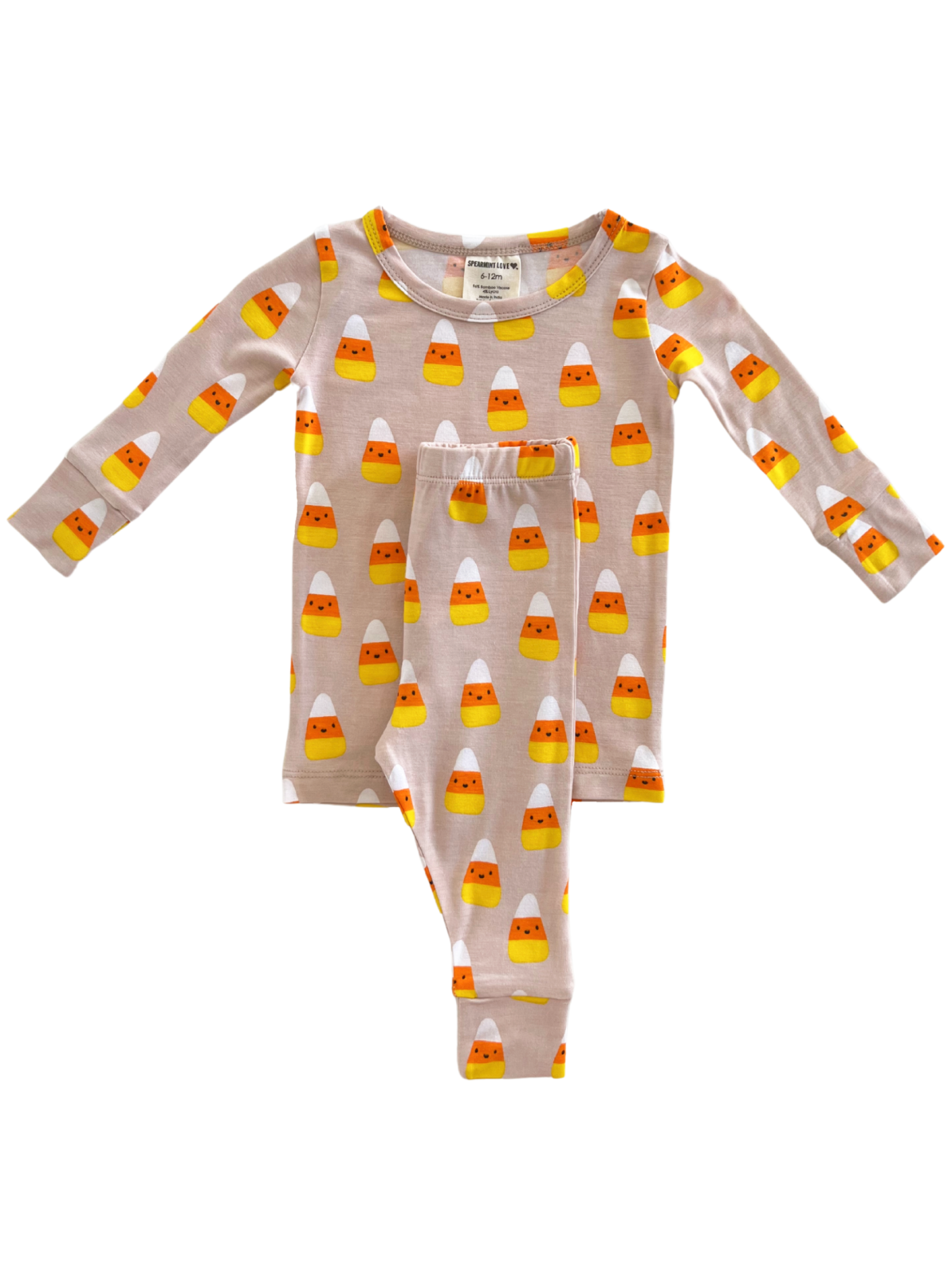 Children's pajama set with candy corn pattern on a light background, featuring long sleeves and pants.