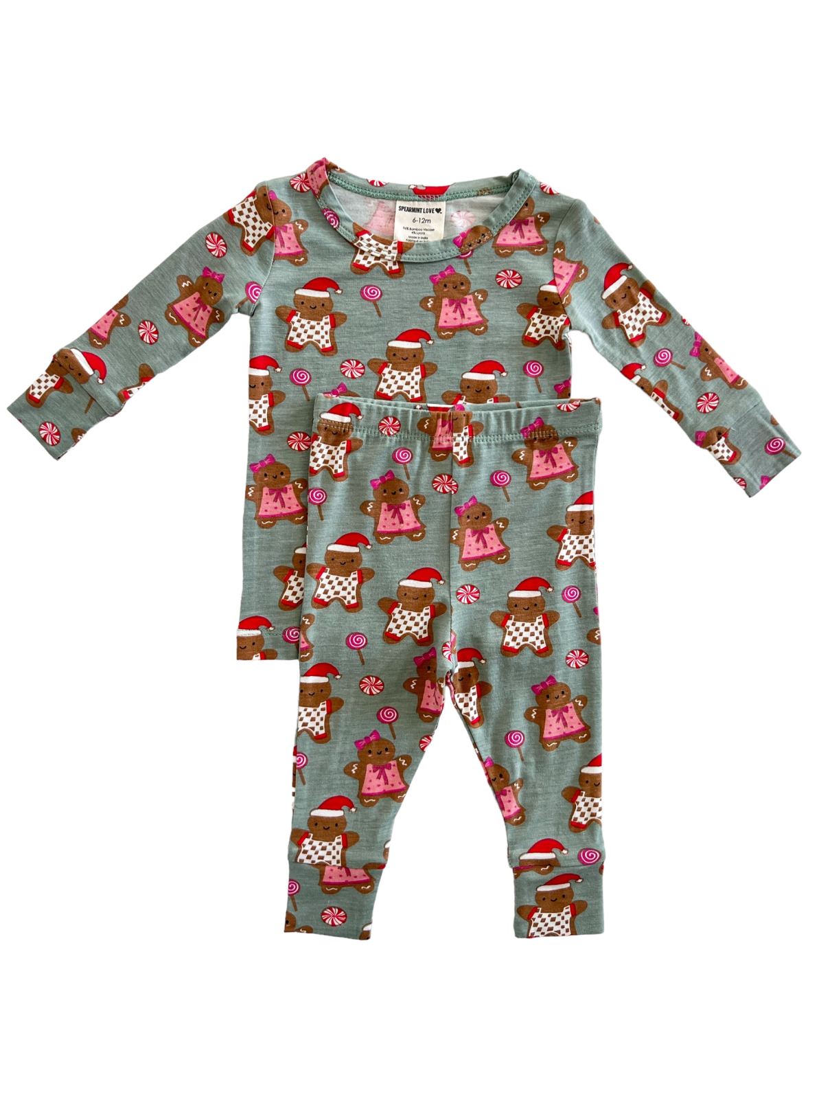 Child's pajama set featuring brown teddy bears in holiday attire on a light blue background.