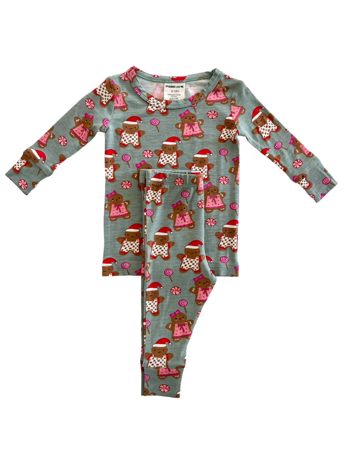 Child's festive pajamas featuring gingerbread designs and candy motifs in light blue. Size 6-12 months.