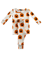 Toddler Halloween pajamas feature a fun pumpkin print on a white background. Perfect for festive nights.