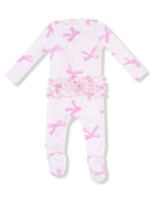 Pink bow-patterned baby onesie with ruffled waist and footed design, featuring long sleeves and soft fabric.