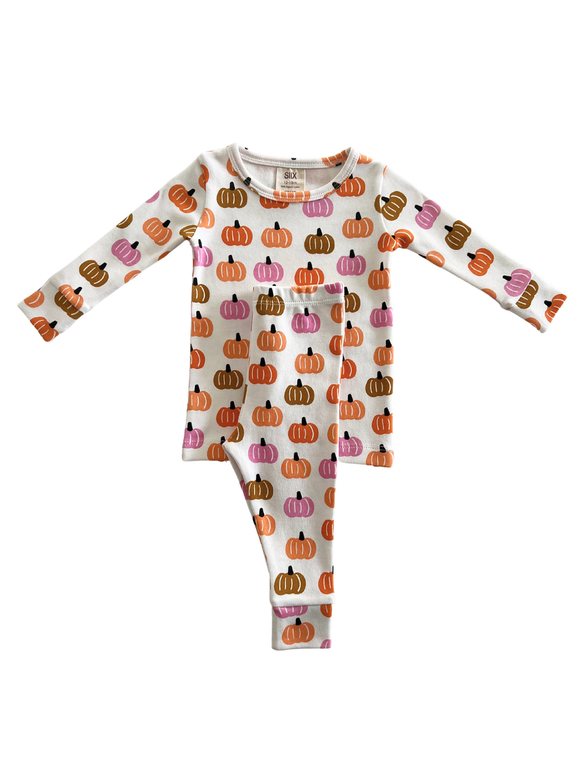 White pajama set featuring colorful pumpkin patterns in orange, pink, and brown hues.