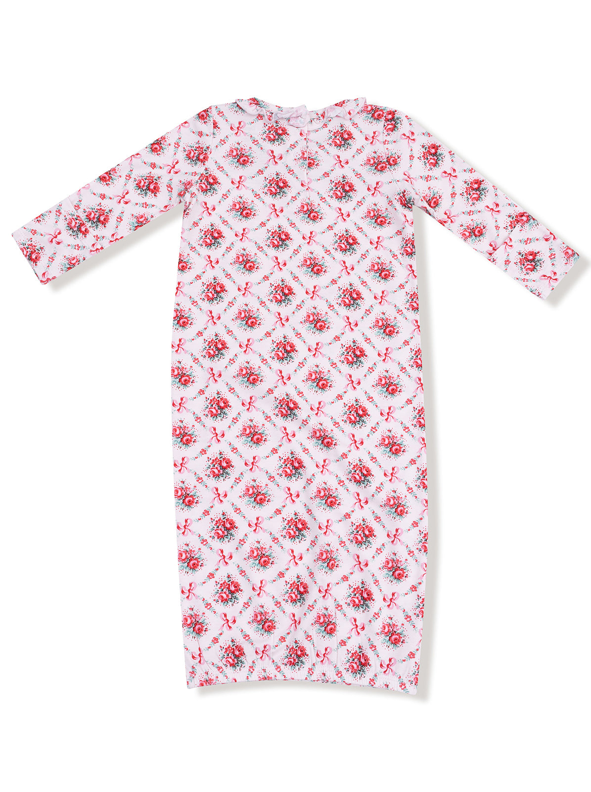 Long sleeve dress featuring a floral pattern with pink roses and bows on a white background.