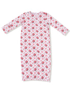 Long sleeve dress featuring a floral pattern with pink roses and bows on a white background.