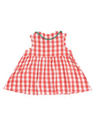 Back view of a red and white checkered dress with a flared skirt and a decorative trim.