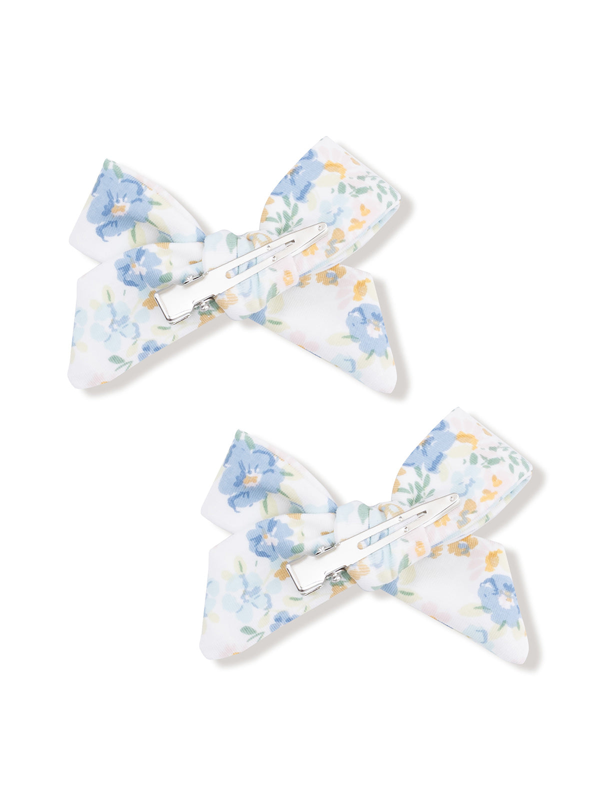 Pair of floral hair clips in light blue and white with a silver clasp.