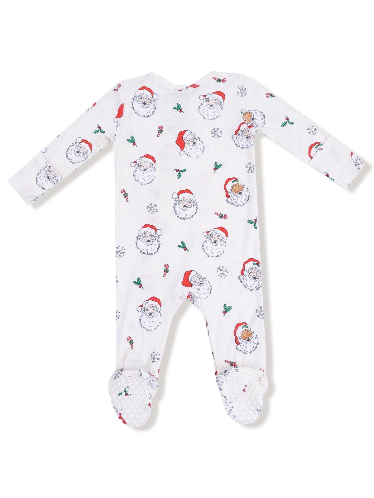 White baby footed pajamas with Santa faces, snowflakes, and candy canes printed throughout.