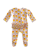 Candy corn patterned children's pajama set with ruffled waistband on a white background.