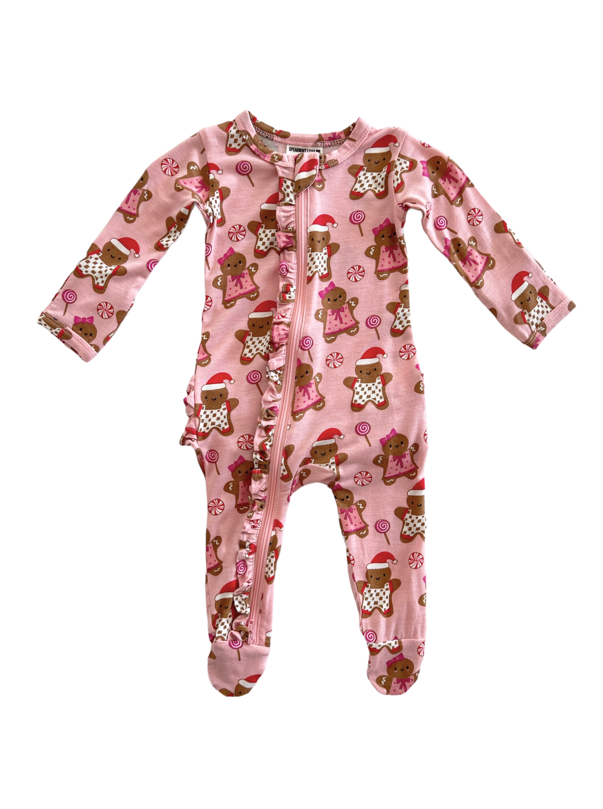 Pink toddler pajamas with gingerbread and candy designs, featuring long sleeves and a front zipper.
