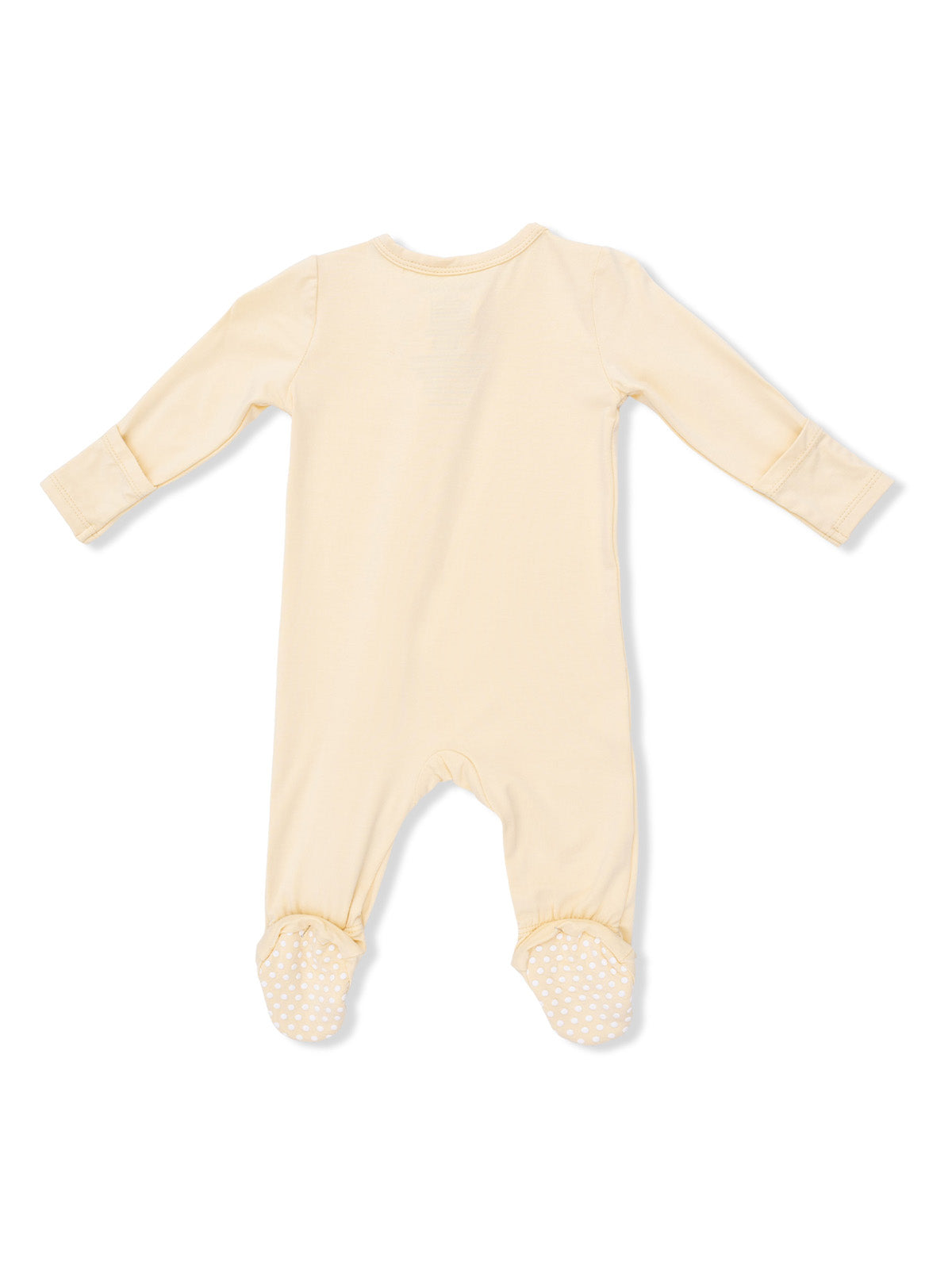 Cream-colored baby onesie with long sleeves and polka dot grips on feet, viewed from the back.