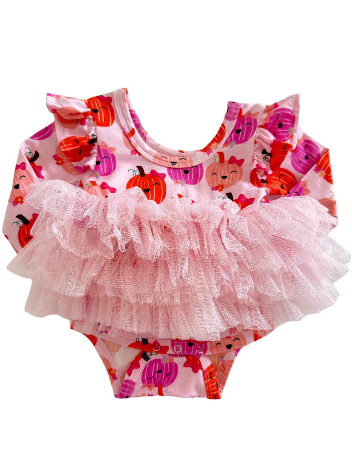Pink baby swimsuit with pumpkin prints and a fluffy tulle ruffle at the waist.