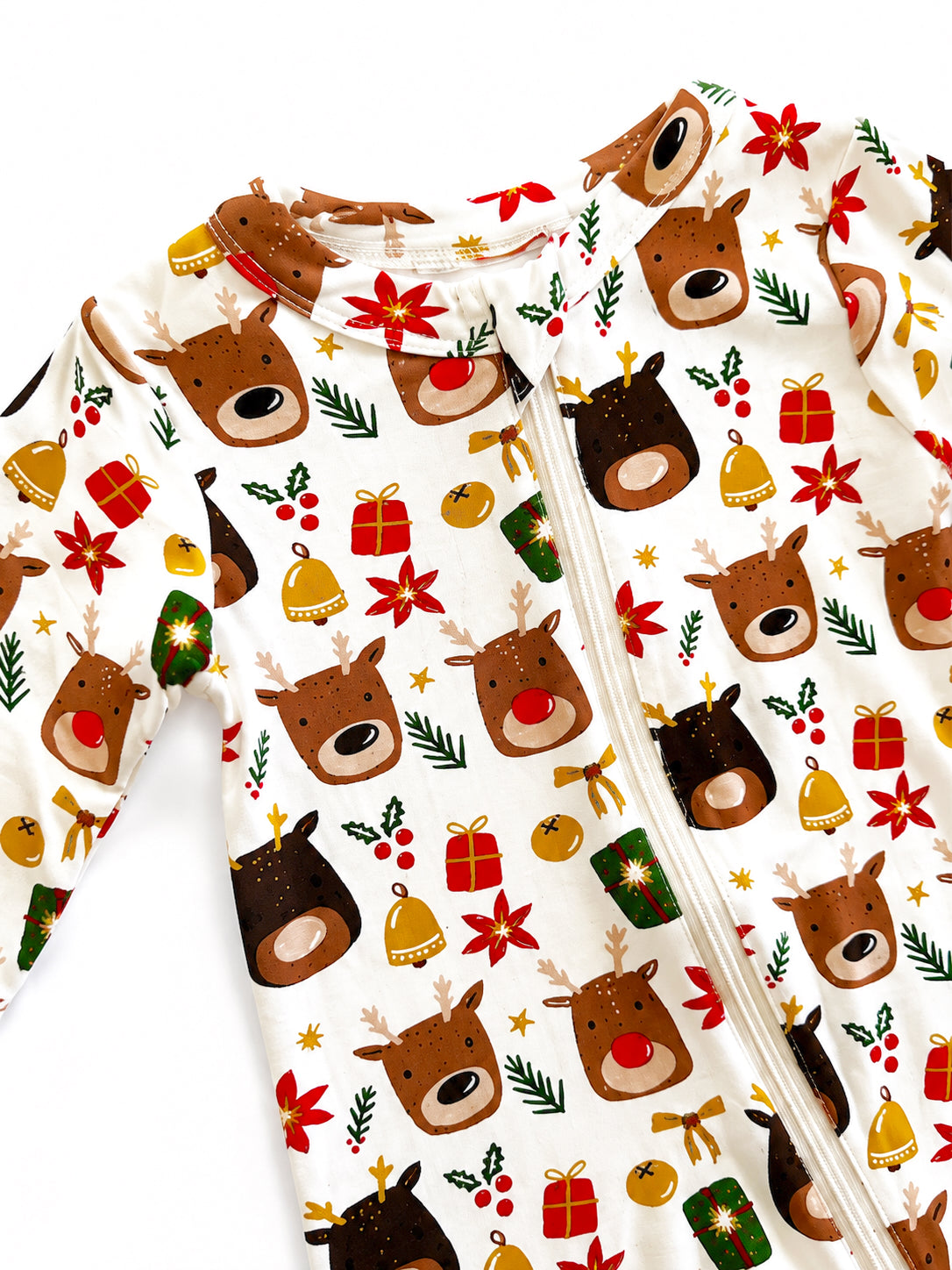 Holiday-themed onesie with reindeer, gifts, and festive decorations on a white background.