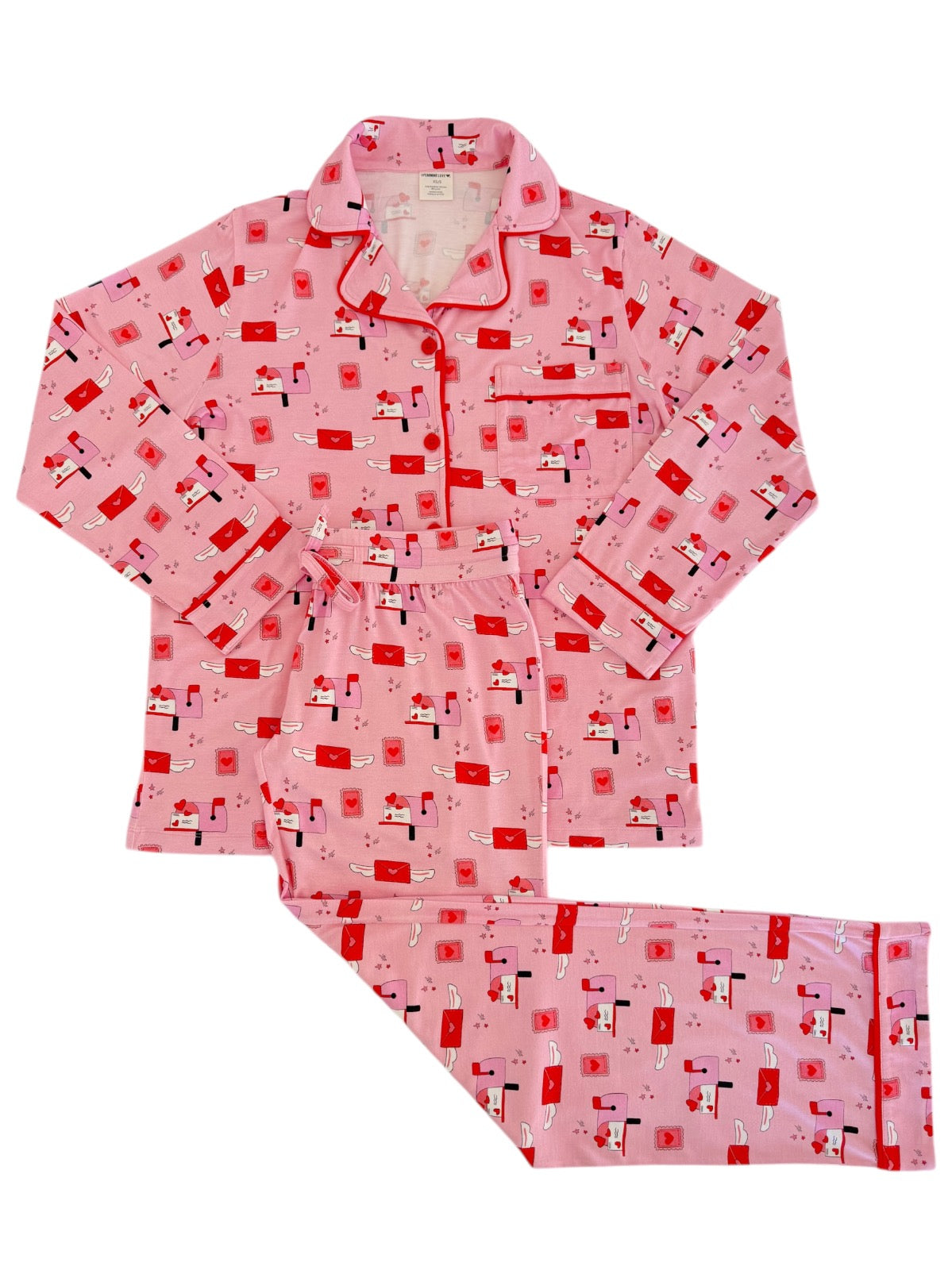 Pink pajama set featuring playful patterns of love letters and postal elements, perfect for cozy nights.