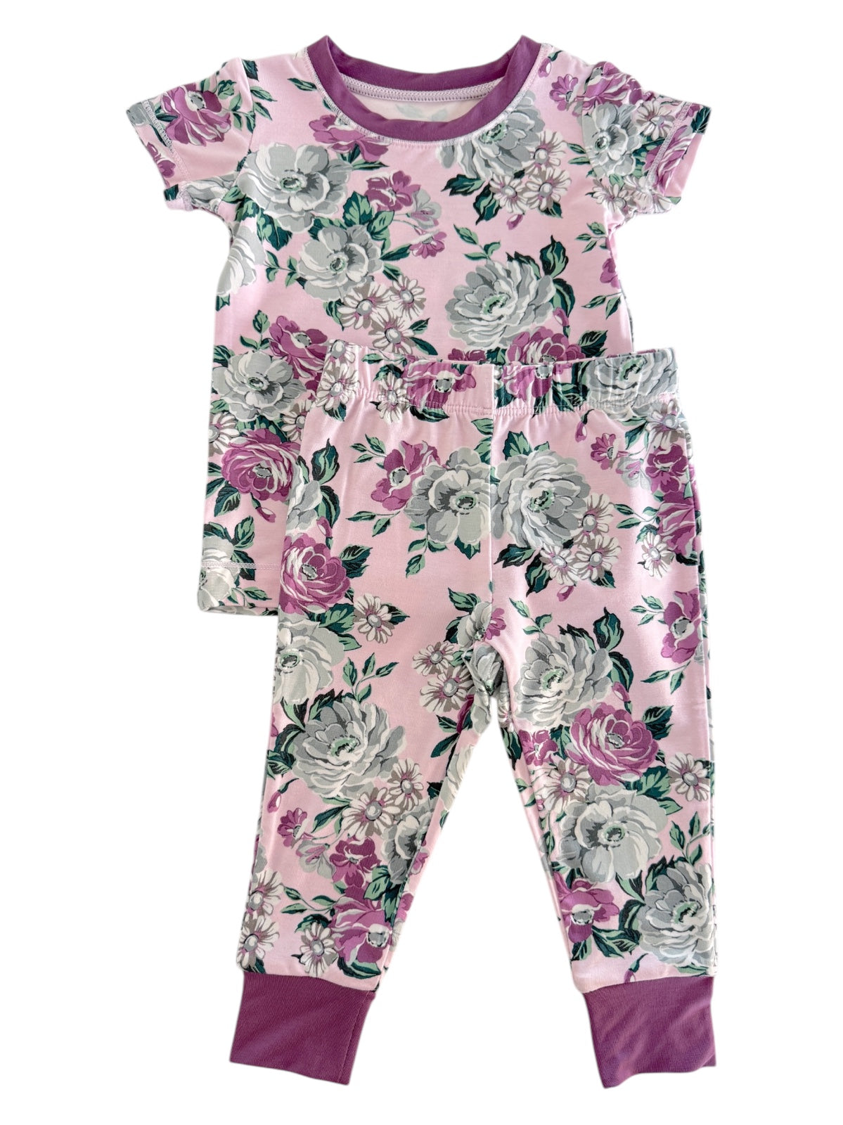Floral pajama set featuring a pink top and matching pants with grey and purple flowers.