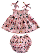Pink children's outfit featuring a smocked top and matching bloomer, decorated with colorful golf cart patterns.