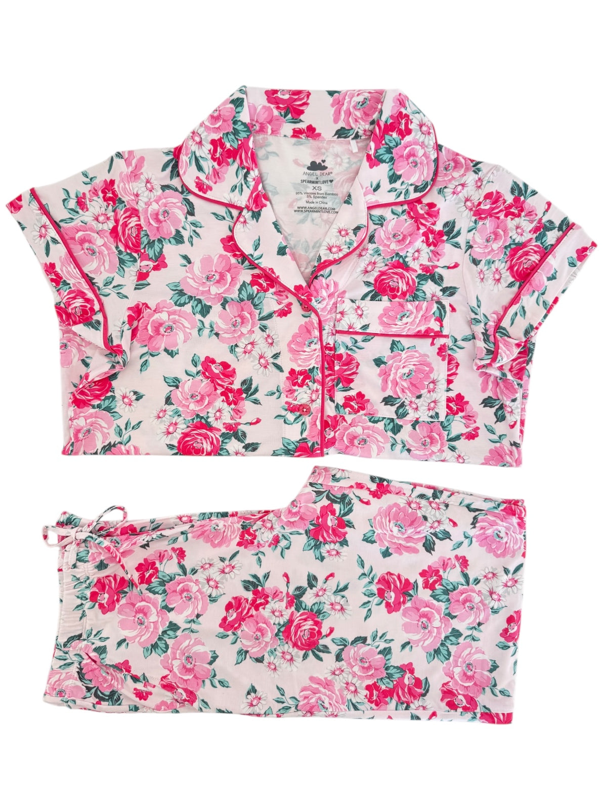 Floral patterned two-piece pajama set in pink and green hues, featuring short sleeves and elastic waistband.