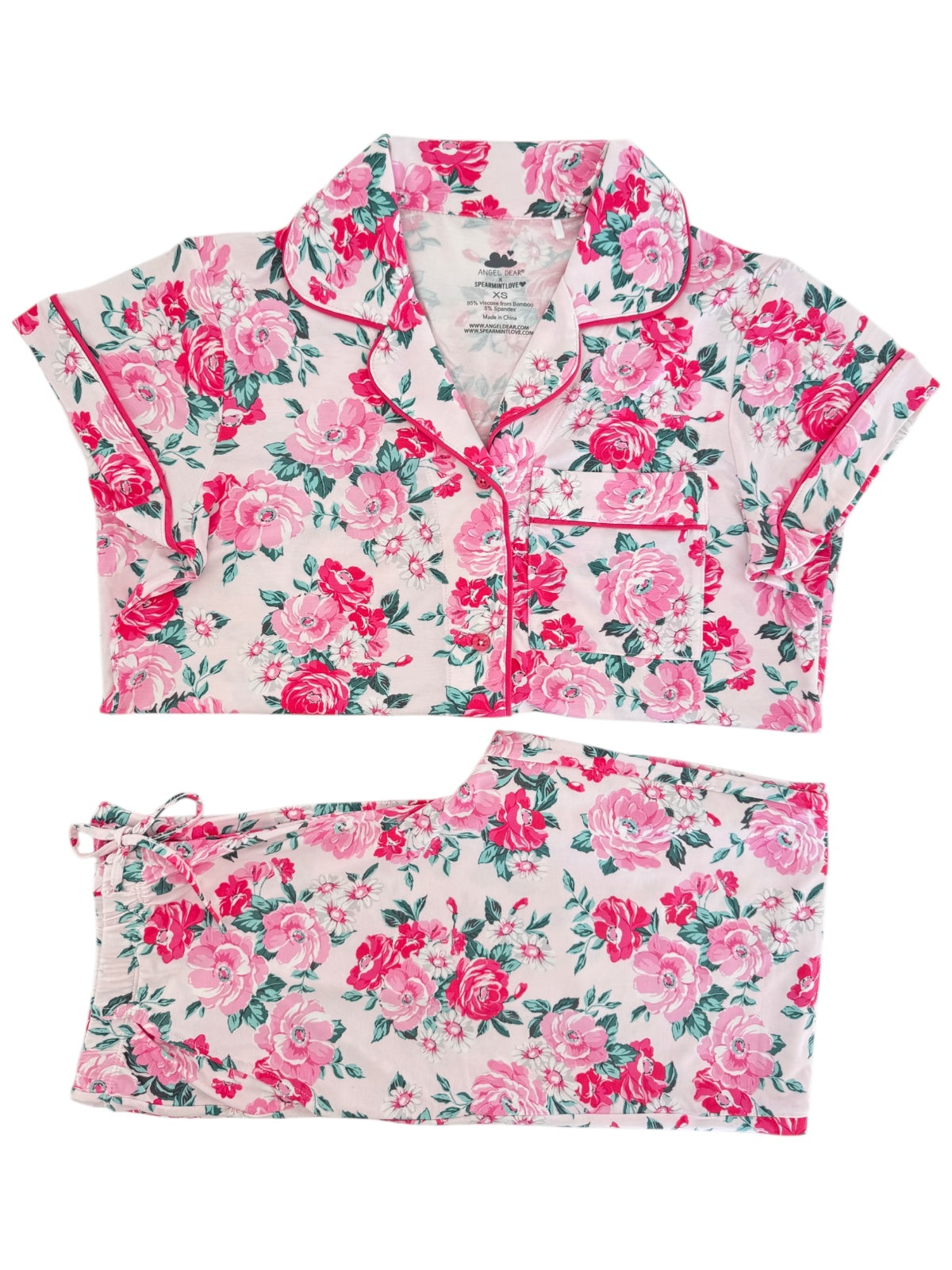 Floral patterned two-piece pajama set in pink and green hues, featuring short sleeves and elastic waistband.