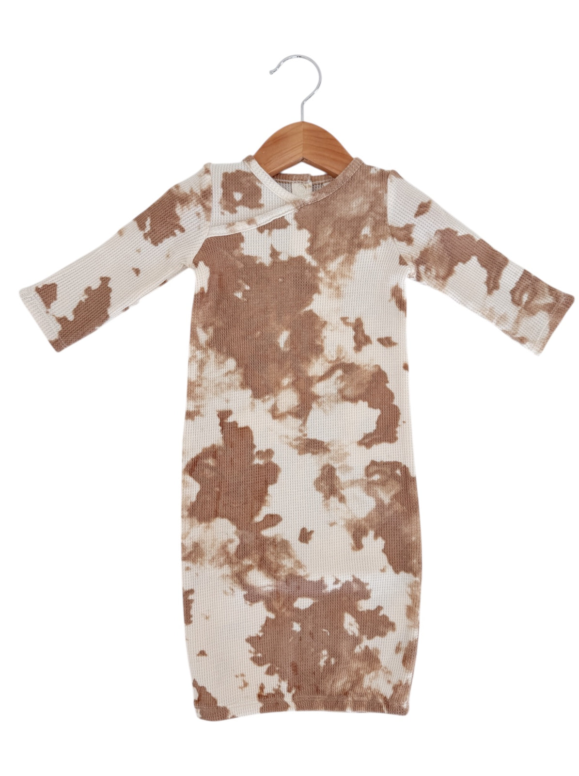 Long-sleeve brown and cream tie-dye dress on a hanger, showcasing a stylish, modern design.