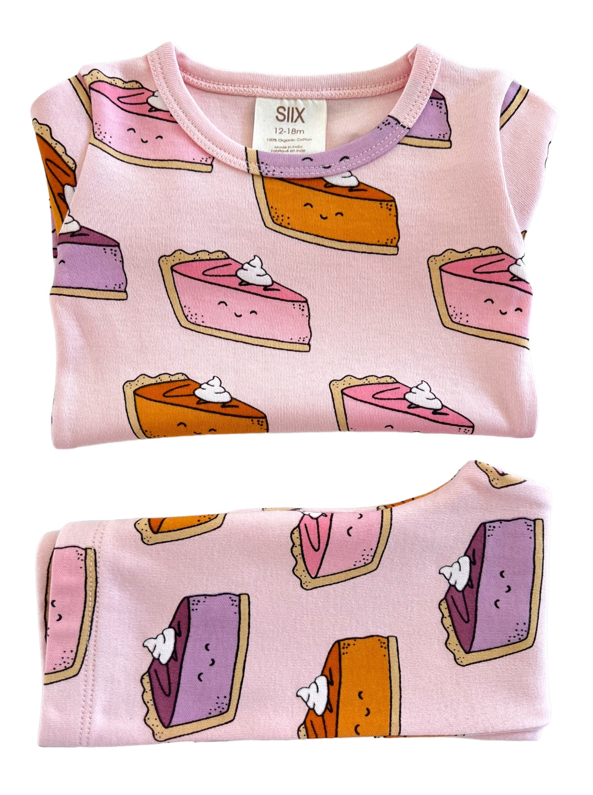 Pink toddler shirt featuring cartoon slices of cake with whipped cream, in sizes 12-18 months.