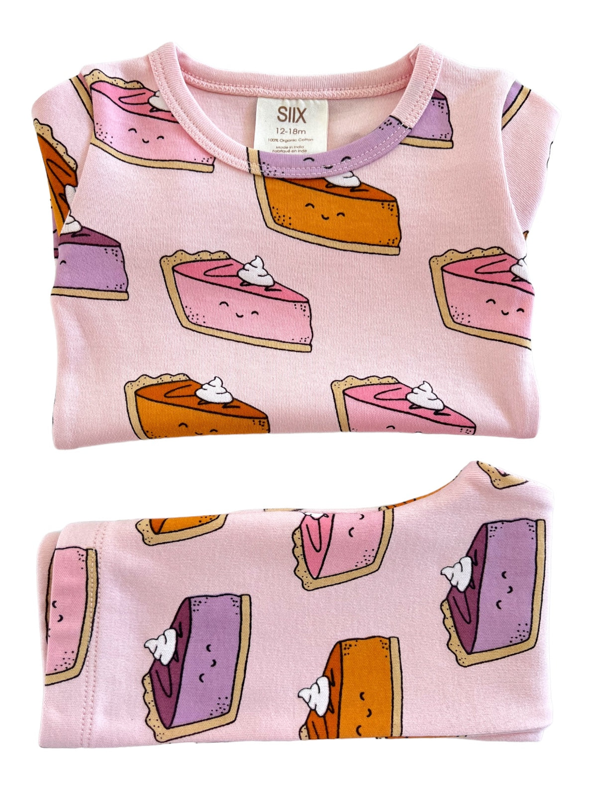 Pink toddler shirt featuring cartoon slices of cake with whipped cream, in sizes 12-18 months.