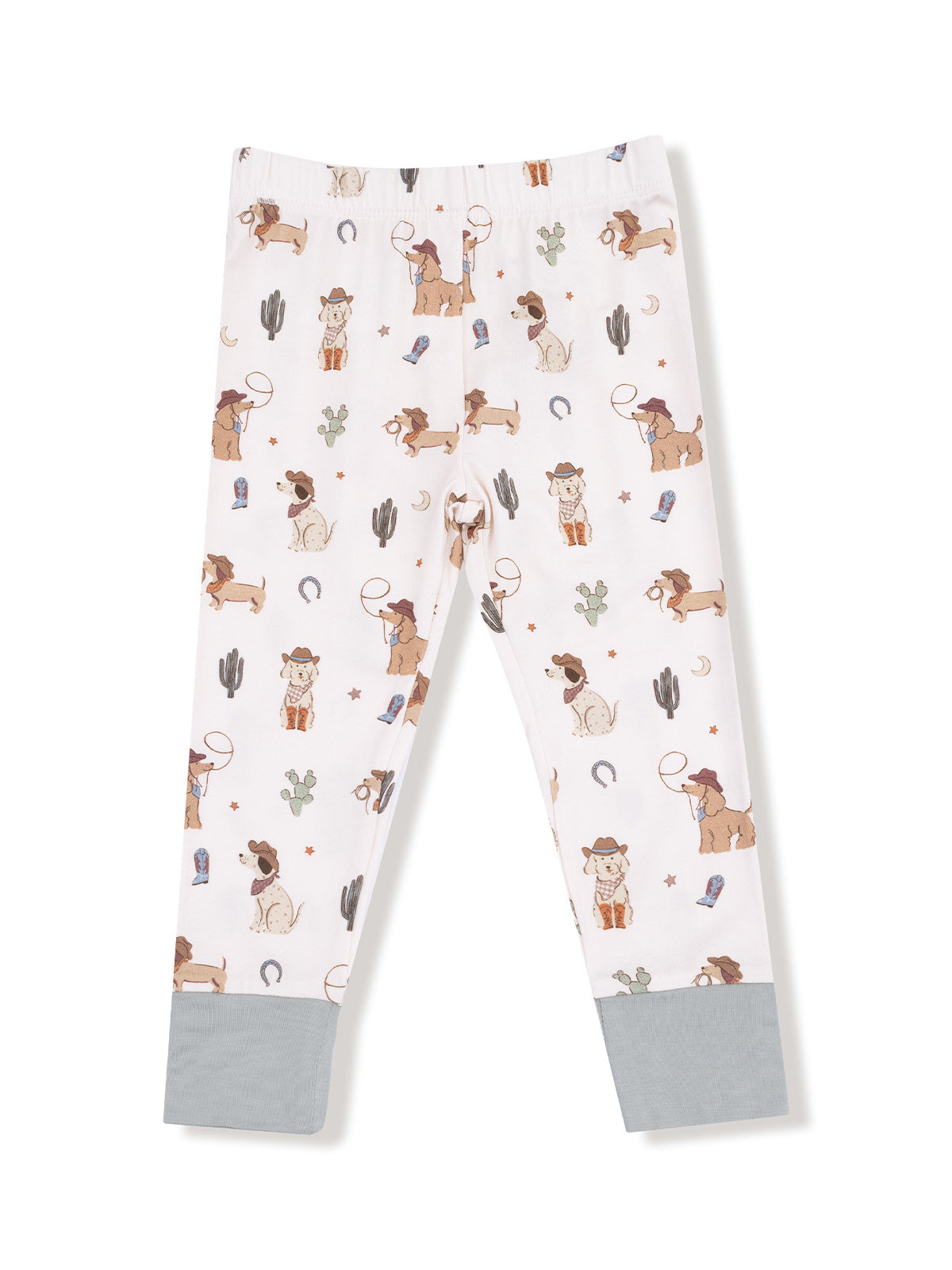 White leggings featuring playful cowboy and dog patterns with cacti and stars. Suitable for kids.